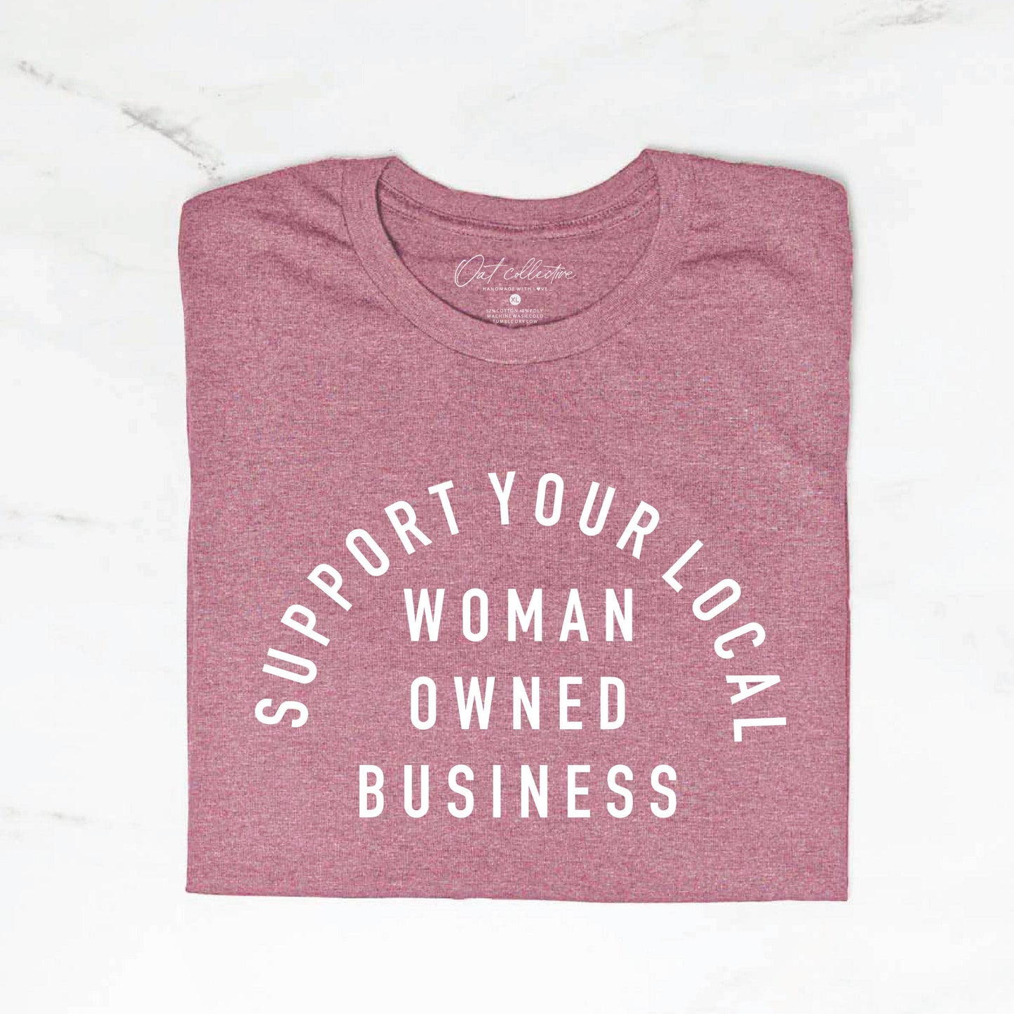 Mauve t-shirt with 'Support Your Local Woman Owned Business' text on a white background